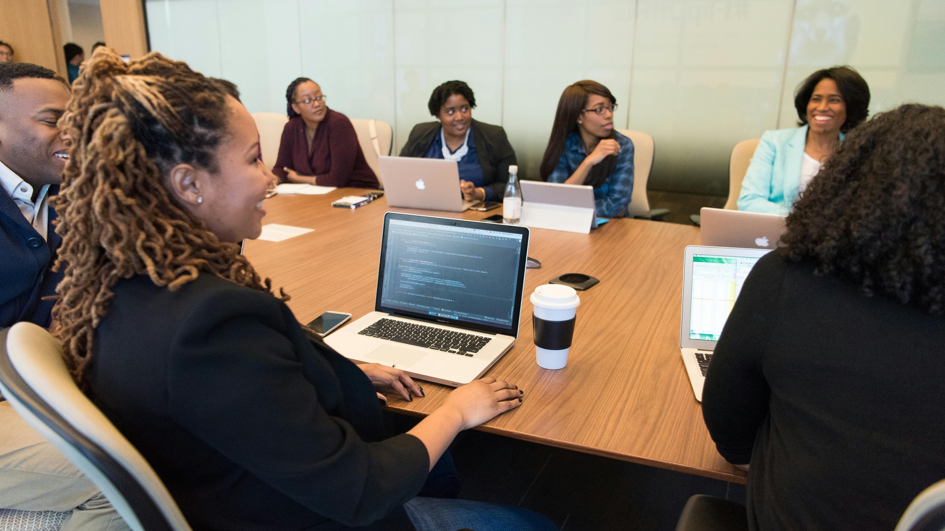 Professional Black women collaborating at modern coworking space